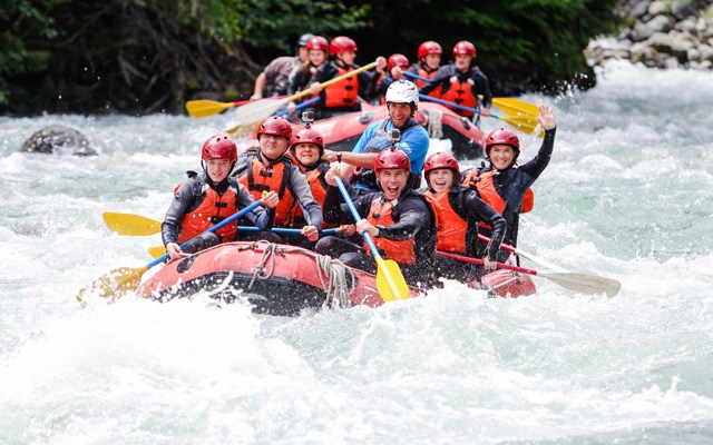 A group white water rafting