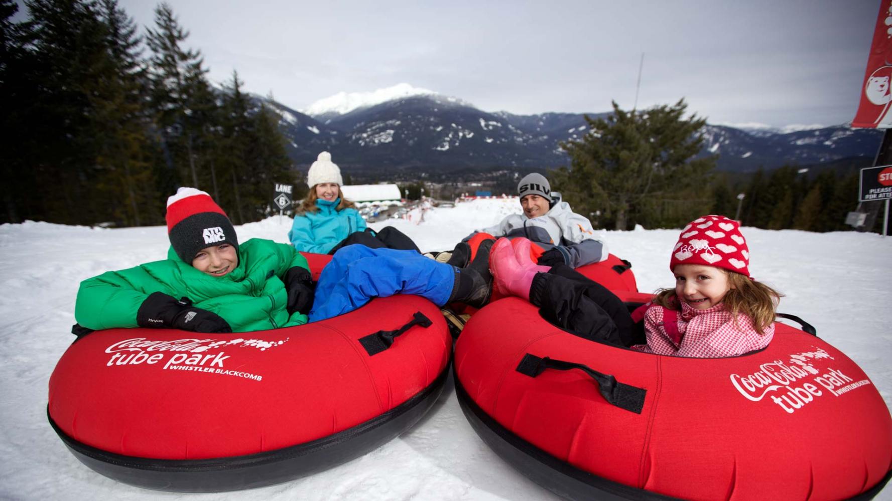 Kids on sleds in winter