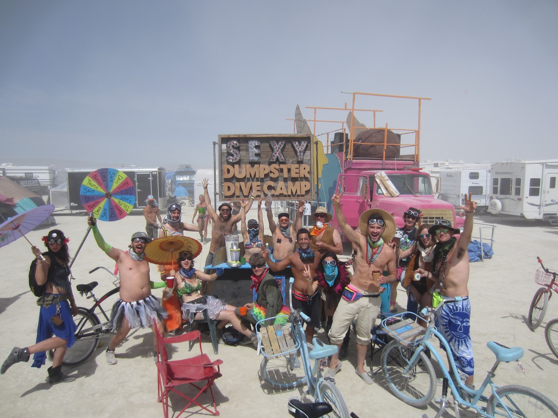 A wild crowd in front of a bar are burning man