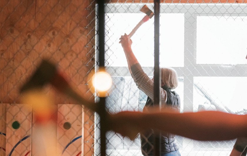 Woman throwing axes