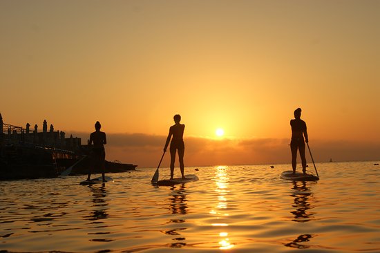 Sup yoga at sunset